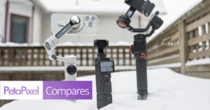 Three gimbals with smartphones are positioned in snow: the Insta360 Flow, DJI Osmo Mobile 6, and Hohem M6. A "PetaPixel Compares" graphic is displayed in the bottom left. Background shows a wooden fence and a house.