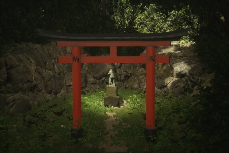 A red torii gate stands amidst lush greenery, with a stone path leading to a small statue. Sunlight filters through the trees, highlighting textures on the rocks and foliage. Japanese characters are inscribed on the torii.