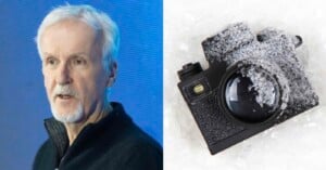 A man with short white hair and a trimmed beard stands in front of a blue background. Next to him, a black camera covered in frost or snow rests on an icy surface.