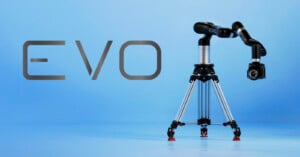 A black robotic camera arm labeled "EVO" is mounted on a silver tripod against a light blue background. To the left, "EVO" is written in large letters.