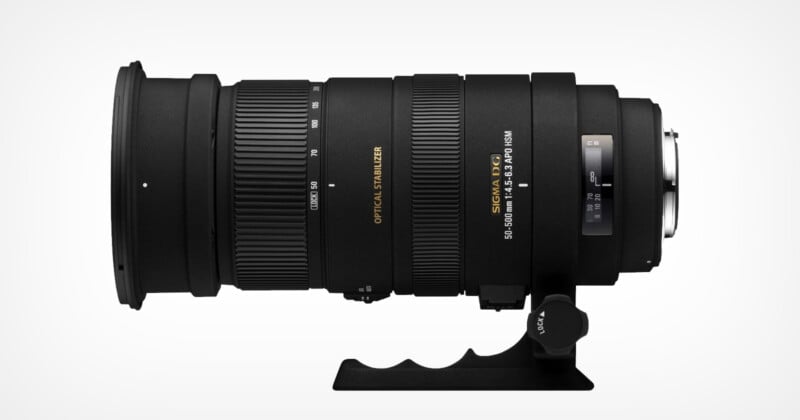 A black Sigma telephoto zoom lens with optical stabilization, marked 50-500mm 1:4.5-6.3 APO HSM, shown in a side view. The lens has a tripod collar and a zoom ring with marked focal lengths.