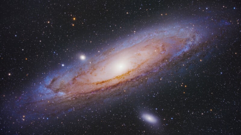 A bright, spiral galaxy with a glowing core surrounded by swirling arms of stars, dust, and gas, set against a star-filled background in deep space.